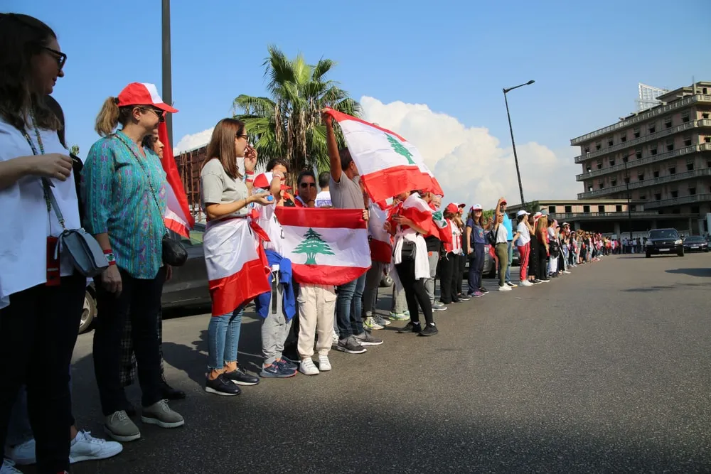 People holding Lebanese flags