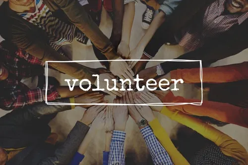 Volunteers stacking hands