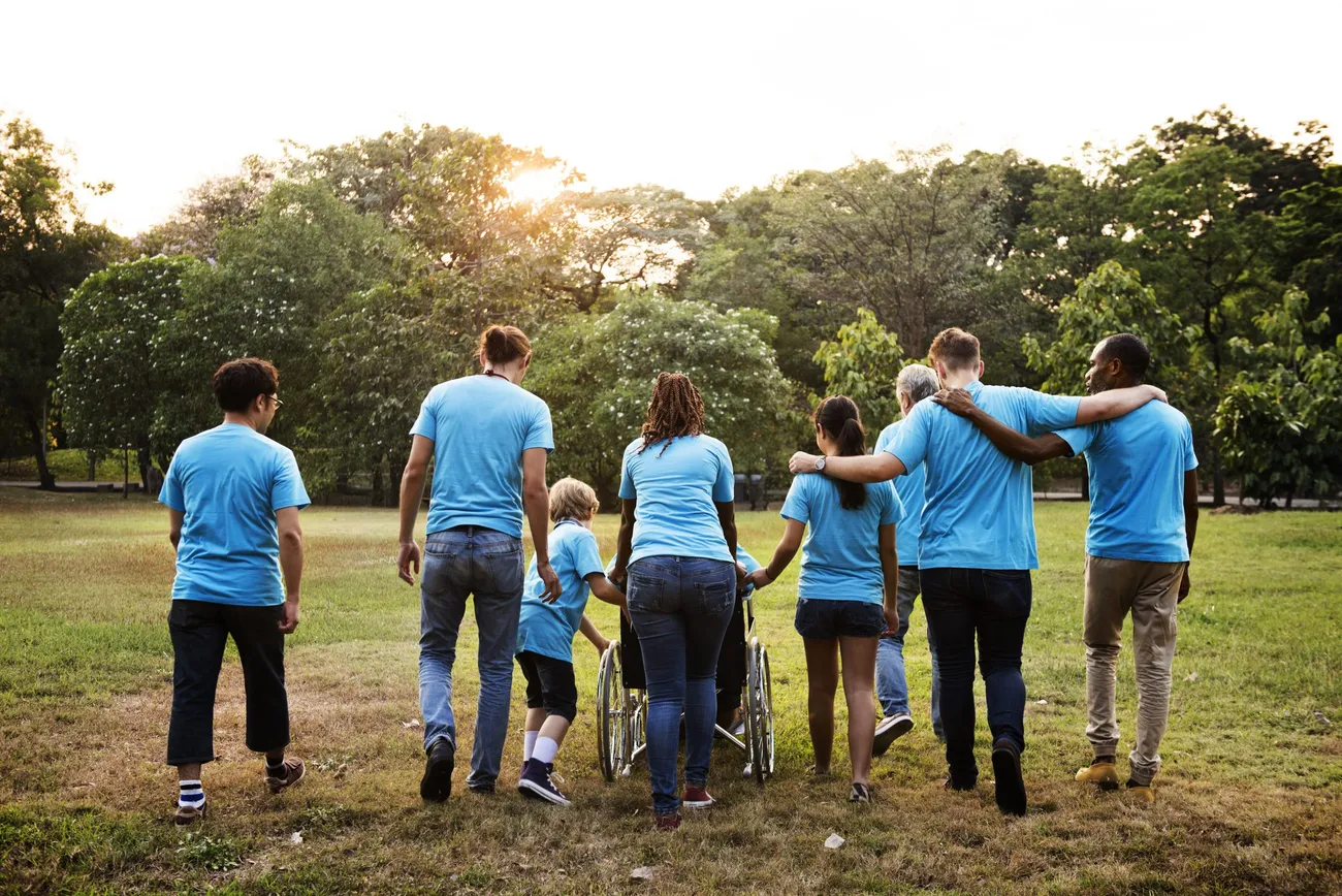 Community members walking together in a park